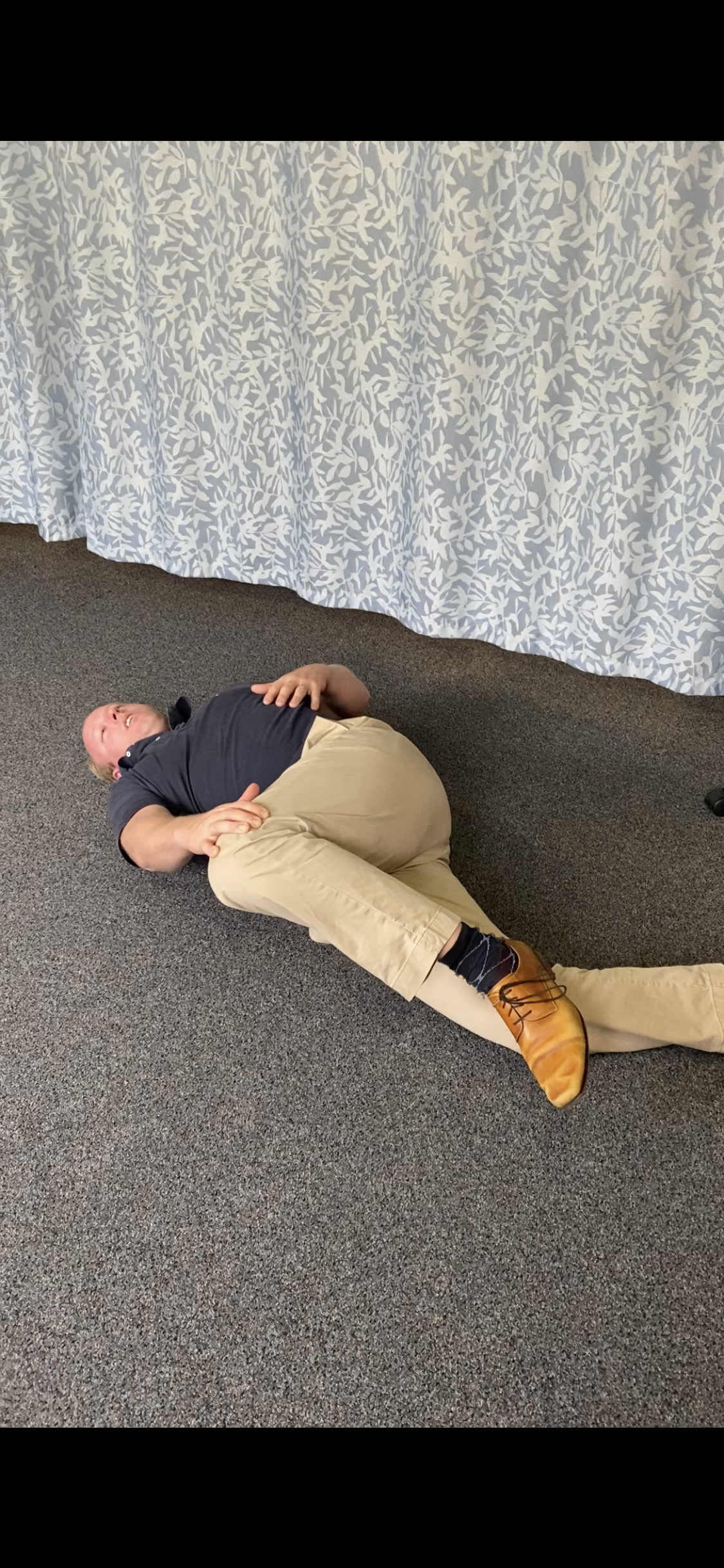 Central Coast Osteopath Dr Daniel Joiner Single leg roll over for low back pain